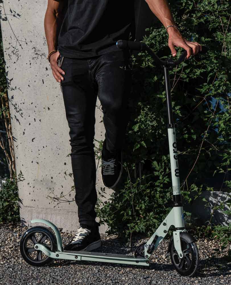man on his speed plus deluxe clay adult scooter