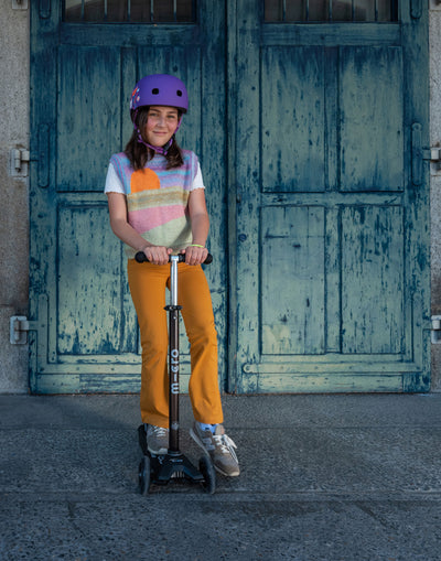 girl riding black maxi micro deluxe eco led scooter