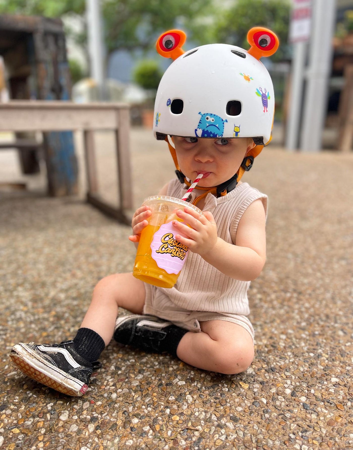 cute toddler wearing a monster theme helmet