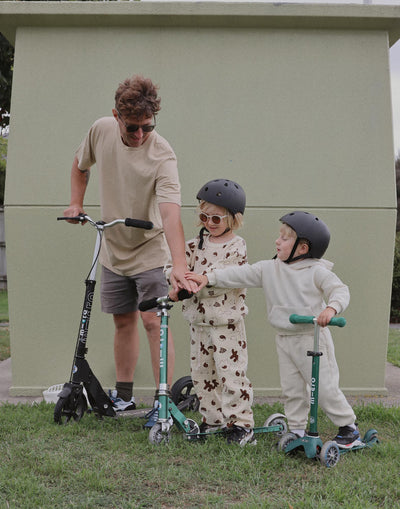 dad on his adult scooter with his kids