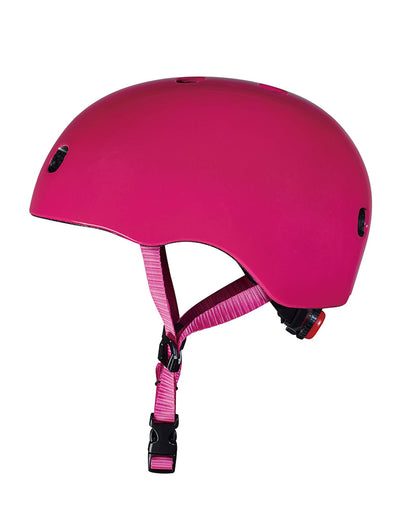 plain pink kids scooter and bike helmet side on