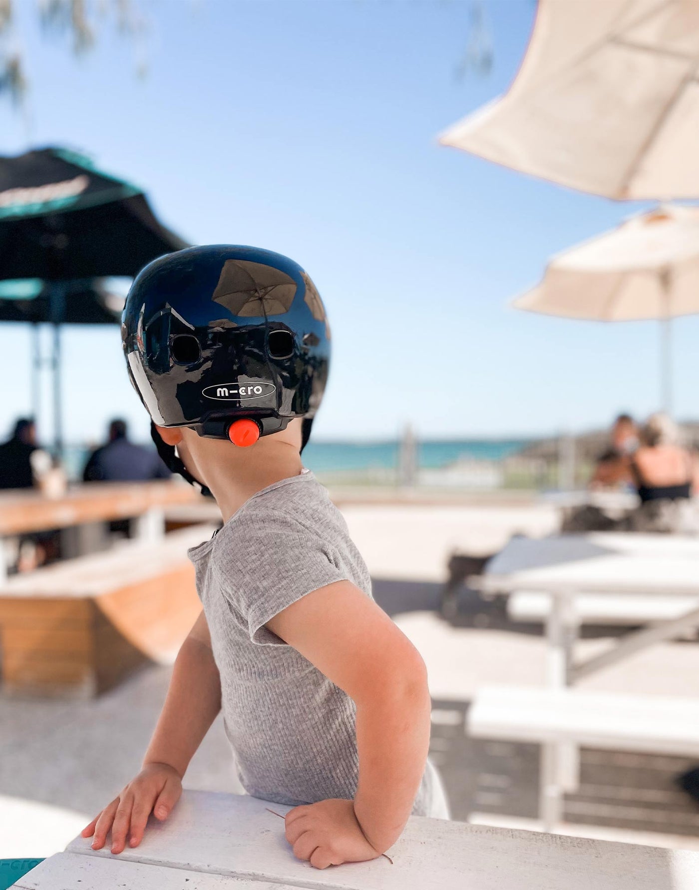 boy wearing his plain black kids helmet