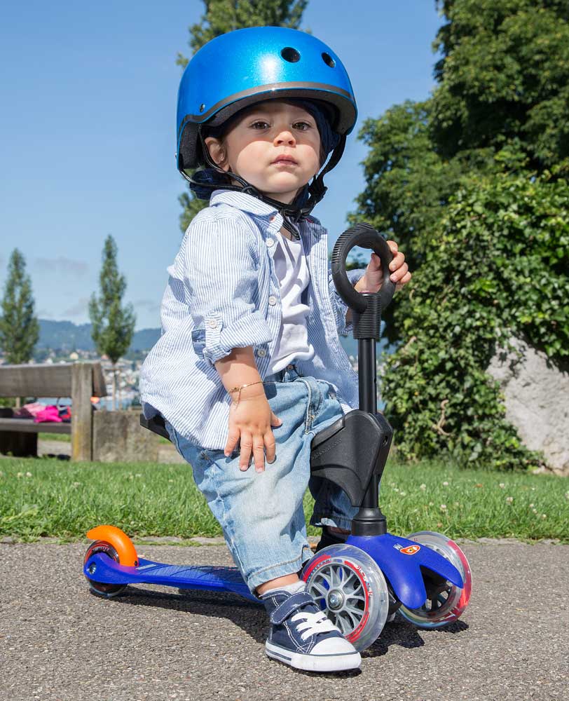 cute toddler on a mini micro seat