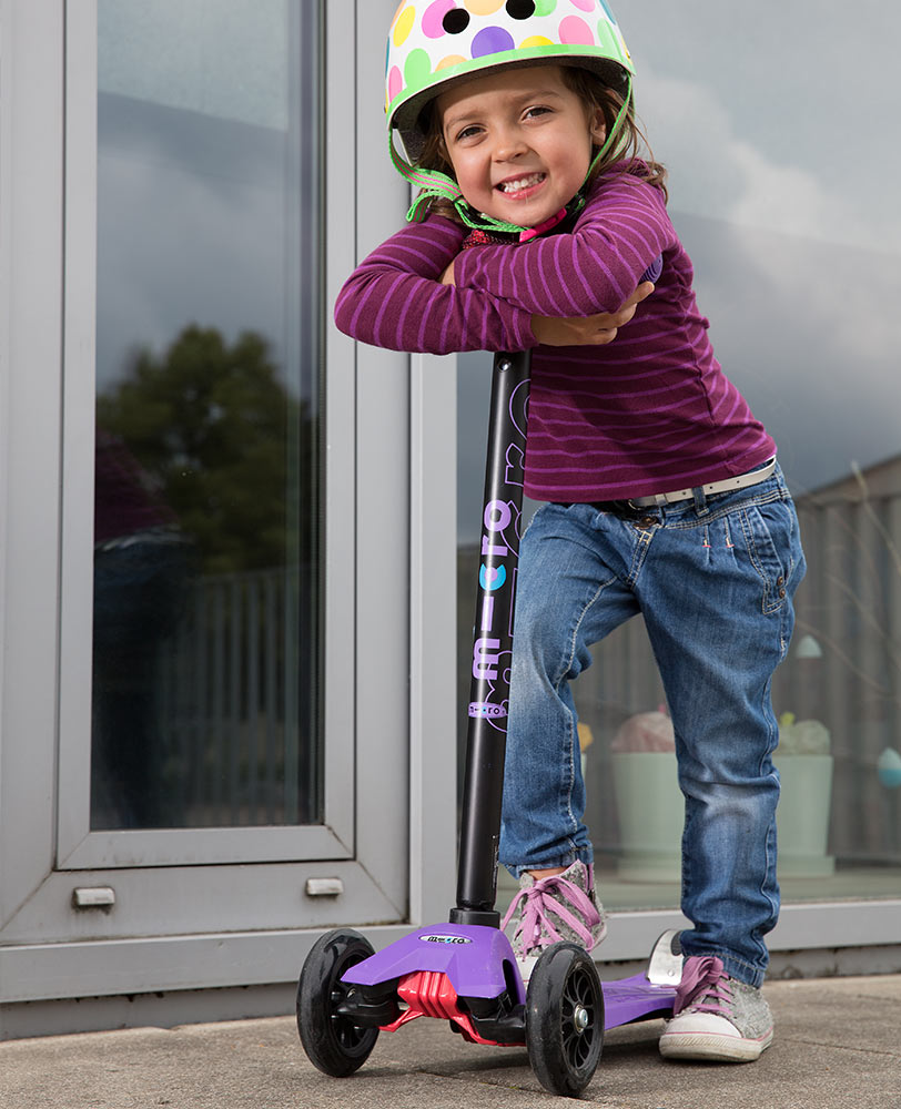 girl on her purple maxi classic scooter
