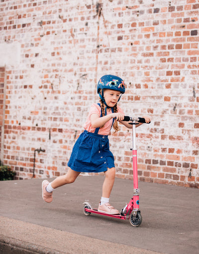 girl riding her favourite pink sprite 2 wheel kids scooter