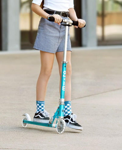 teen riding their favourite ocean blue kids sprite scooter