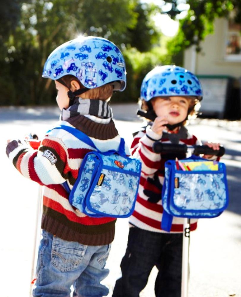 toddlers scooting with blue back pack attached to a mini classic